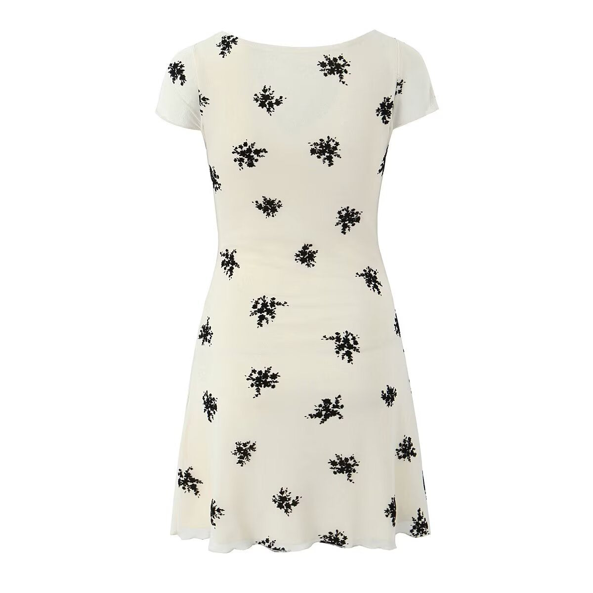Back view cream short sleeve mini dress scattered black floral print flared hem