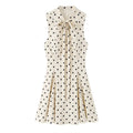 Full front flat lay main product shot, stand tie neck sleeveless mini dress, front hollow tie detail, fitted waist, full flared swing skirt, classic vintage polka dot design