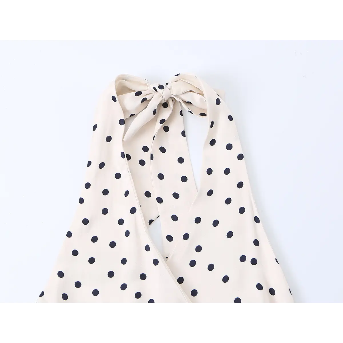 Close-up of the dress's halter neck, showing the tied bow at the back.