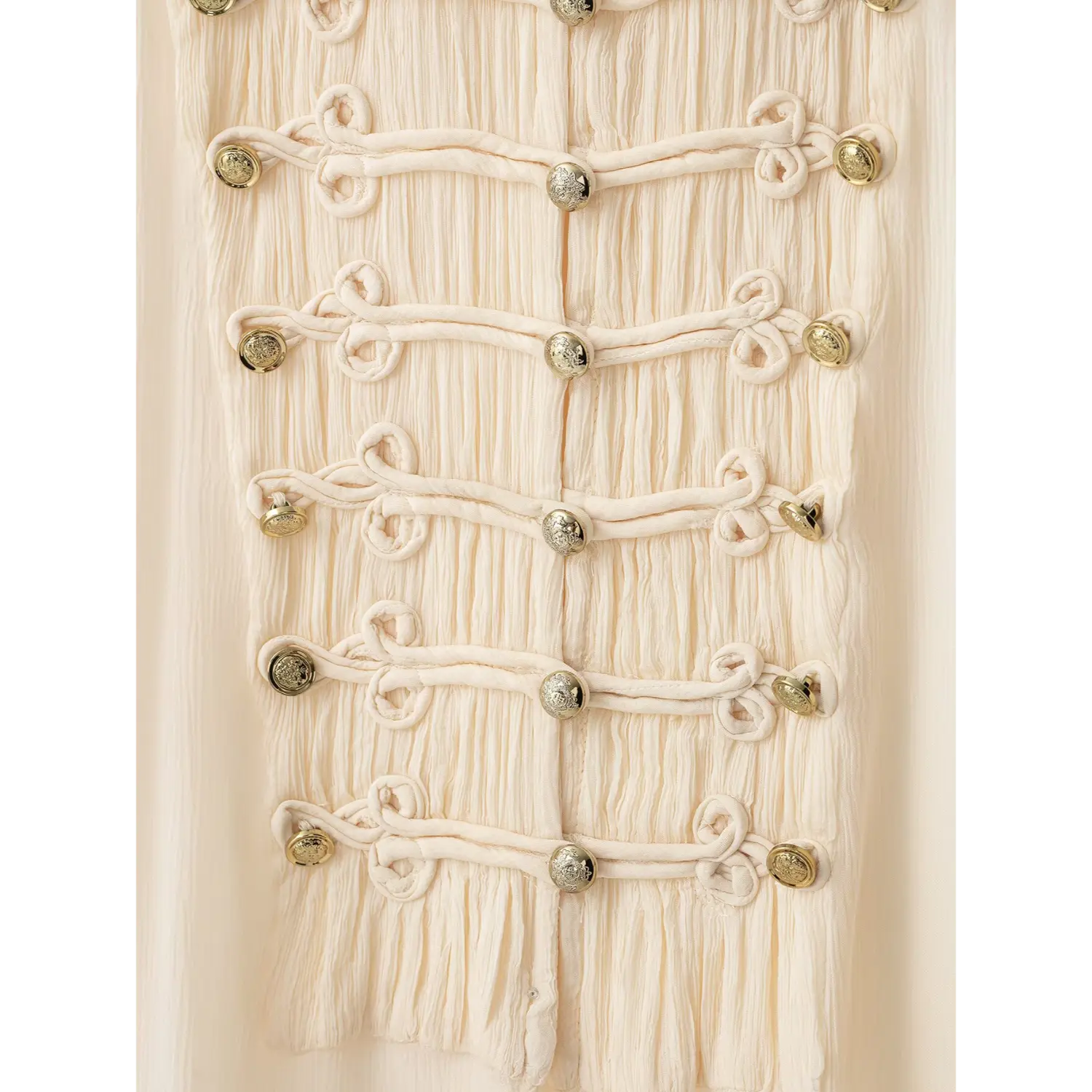 Macro close‑up, decorative frog knot fasteners and vintage gold metal studs detail