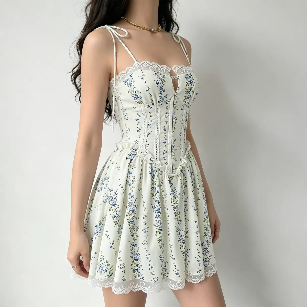  Profile view of a model in a cream floral corset dress, highlighting the fitted bodice and lace hem.