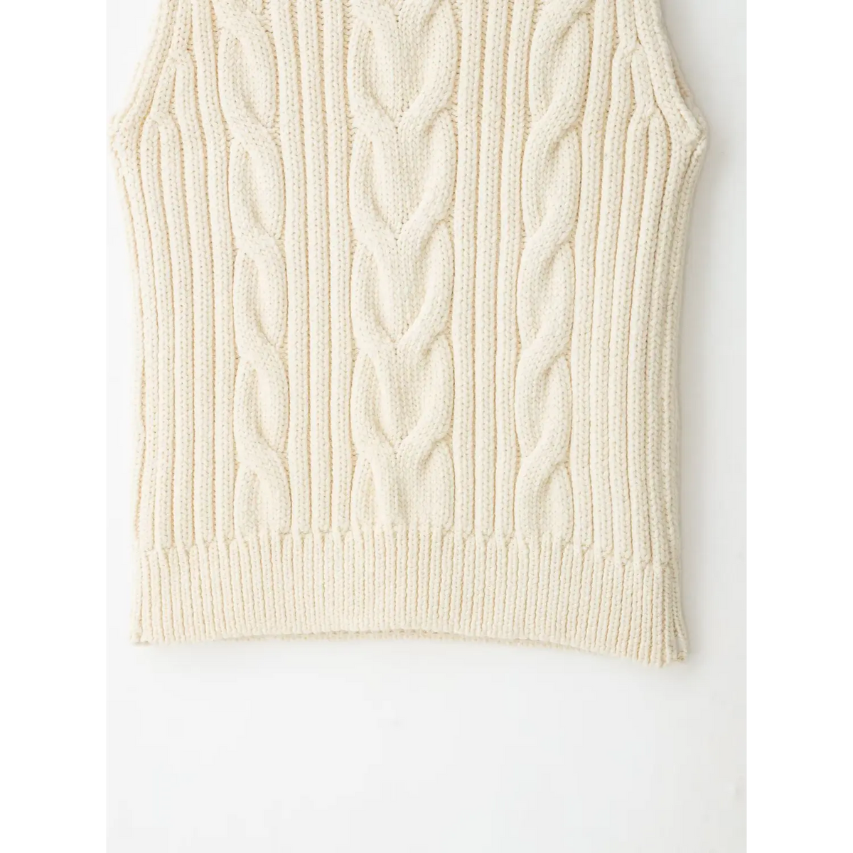 Close-up of back hem and cable knit pattern