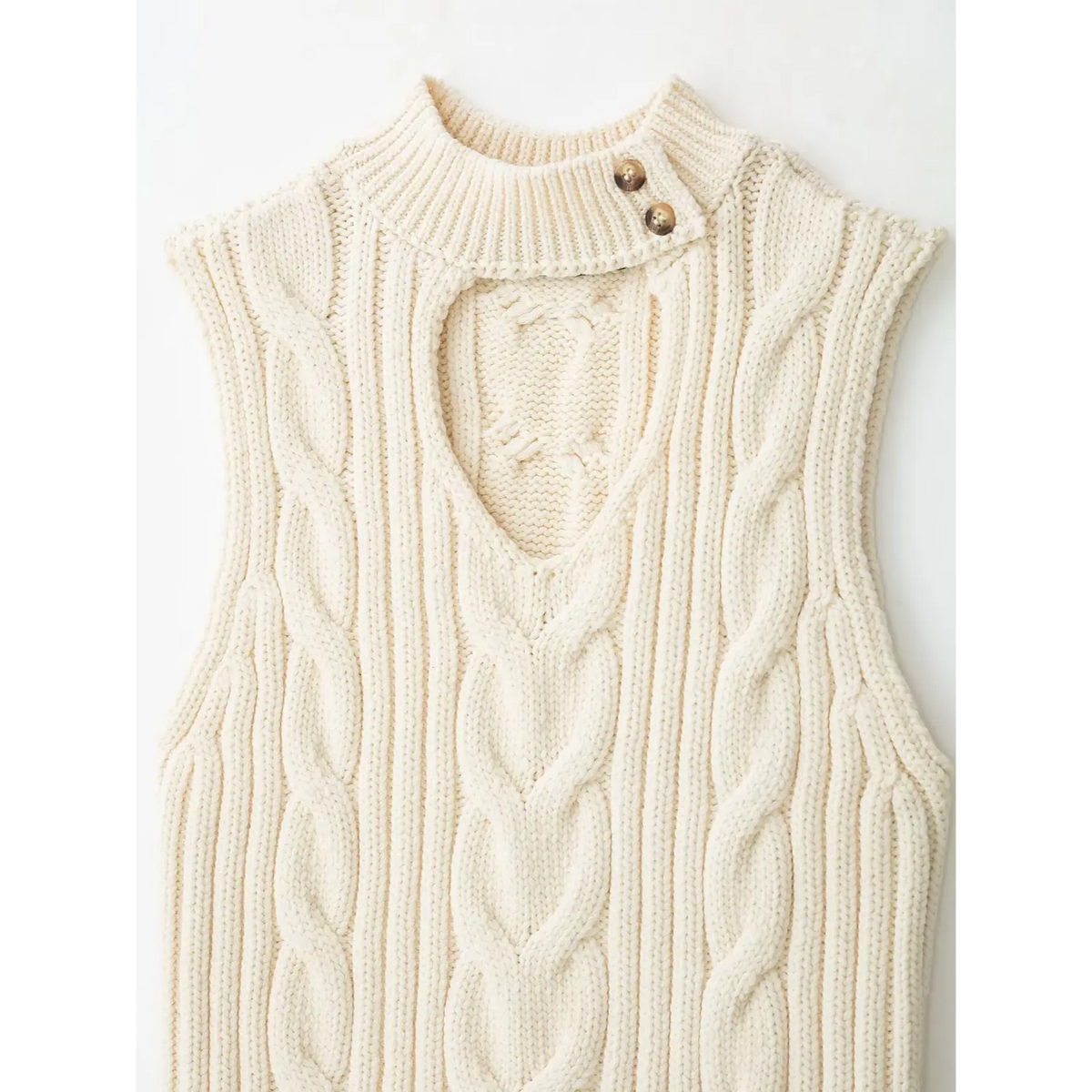 Close-up of mock neck cutout and button placket