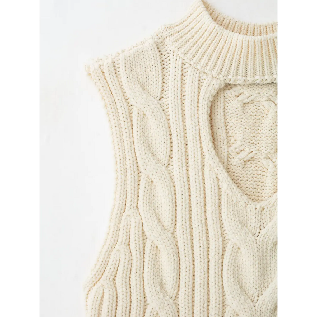 Close-up of shoulder armhole and cable knit stitch