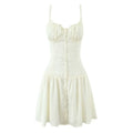 White background front view cream cami mini dress ruffle neck front button down ruched bust flared skirt