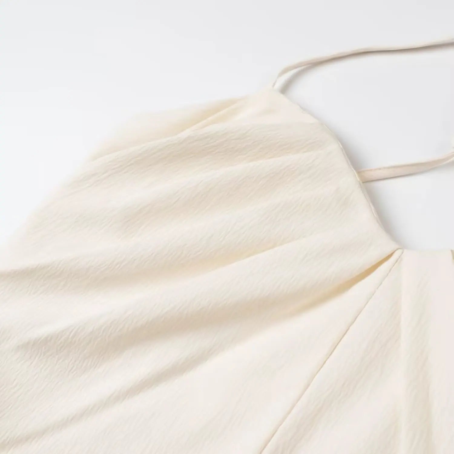 Light textured fabric and front pleat detail cream cropped cami top