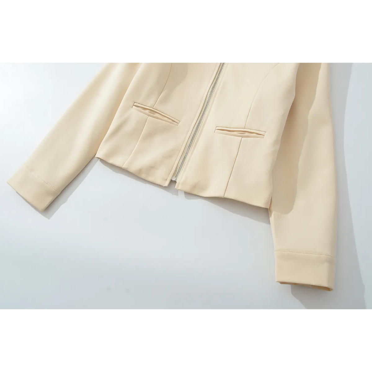 Close-up of cropped hem and waist welt pockets