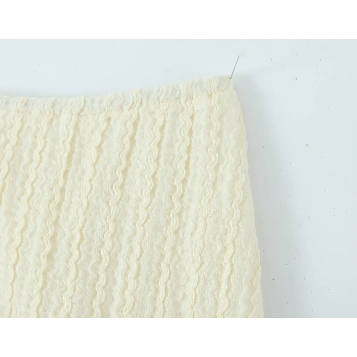 Front view detail of the cream lace crochet mini skirt, showing the full silhouette