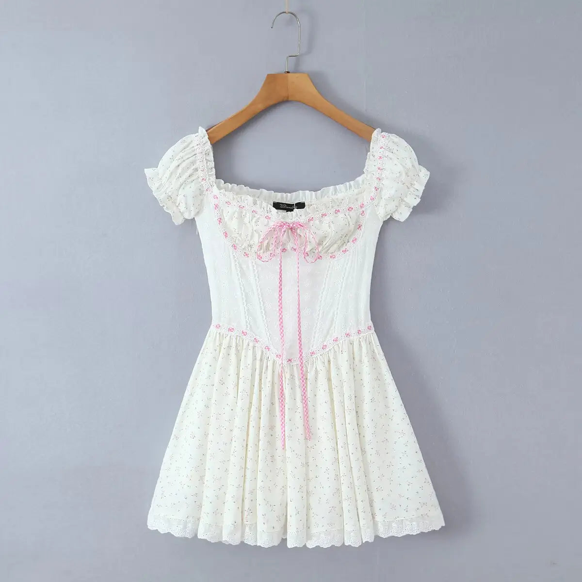 Hanging front view of the dress, showing the full silhouette with puffed sleeves, corset bodice, and flared skirt.
