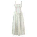 Full front view of the dress, featuring the corset-style bodice, lace trim, and vertical floral print maxi skirt.