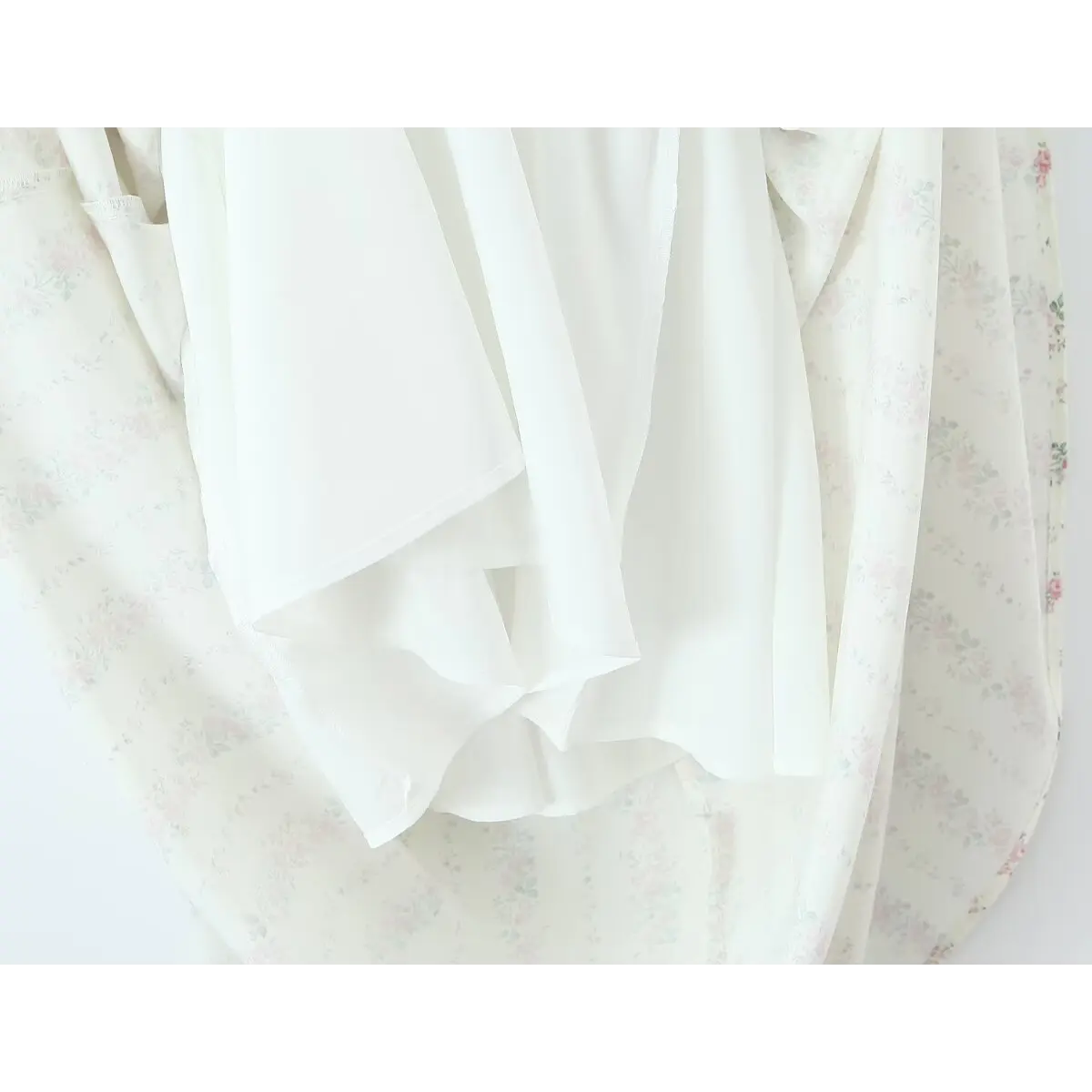 Close-up of the dress lining, showing the smooth inner layer and floral print outer fabric.