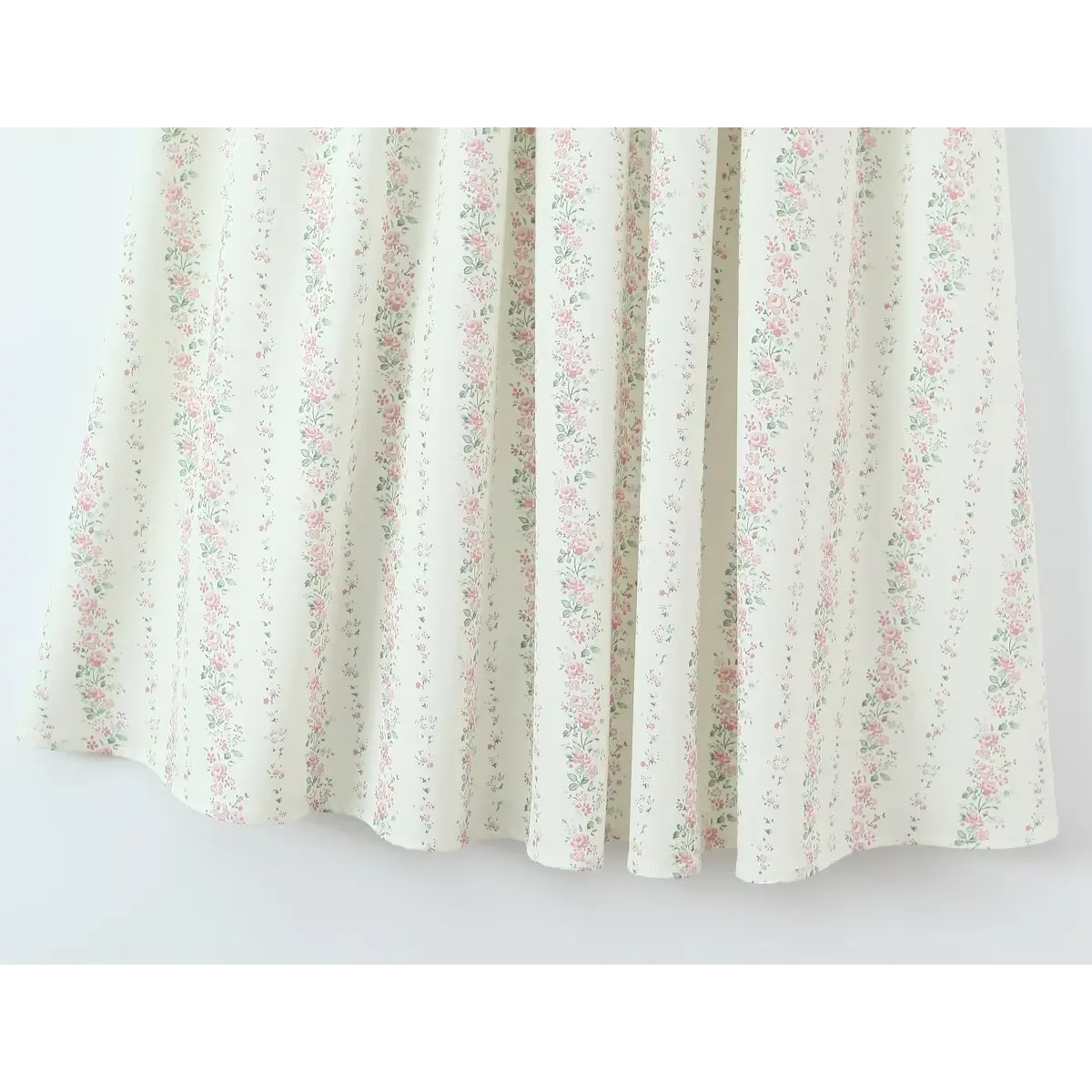 Close-up of the full gathered skirt hem, showcasing the vertical floral stripe print.