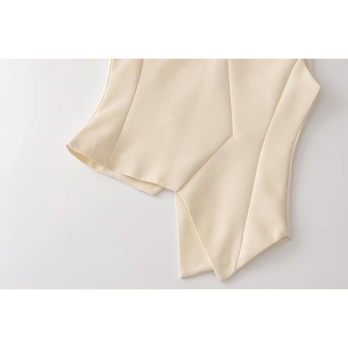 Close-up of back asymmetric hem