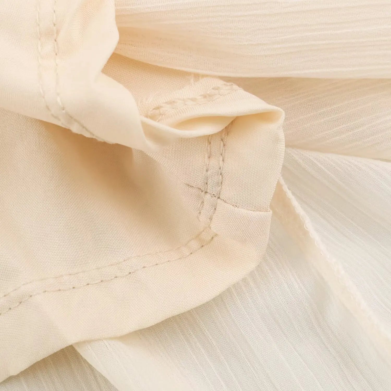 Detail shot stitching and inner lining fabric of cream boho maxi dress