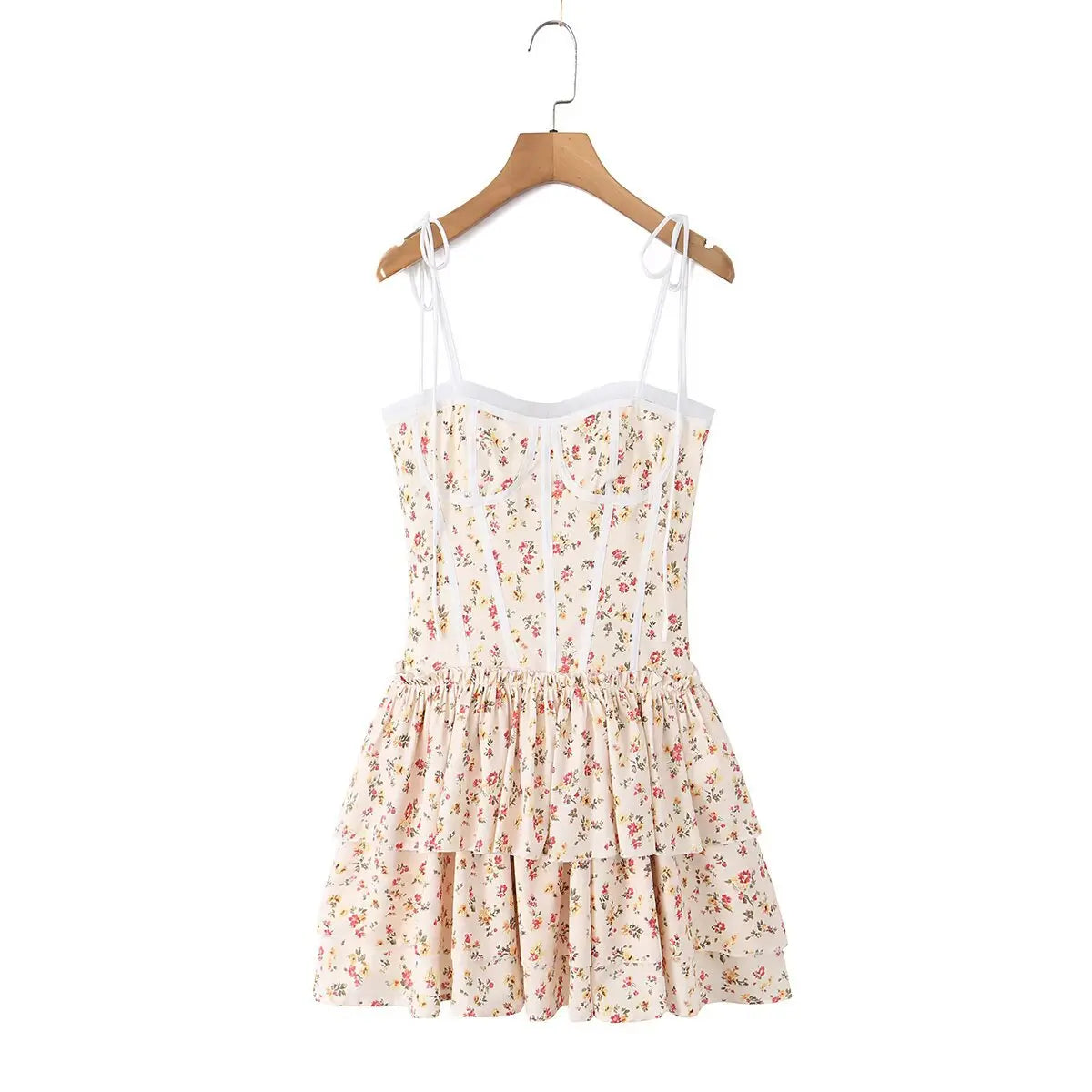 Cream floral print tiered cami dress hanging on wooden hanger, front view