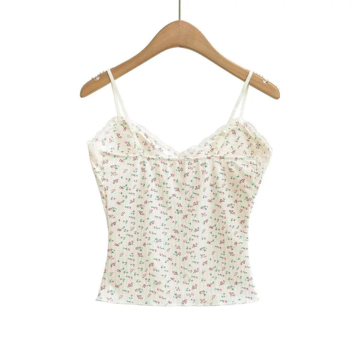 Back view of a cream floral cami top, showing the adjustable straps and V-shaped back neckline.