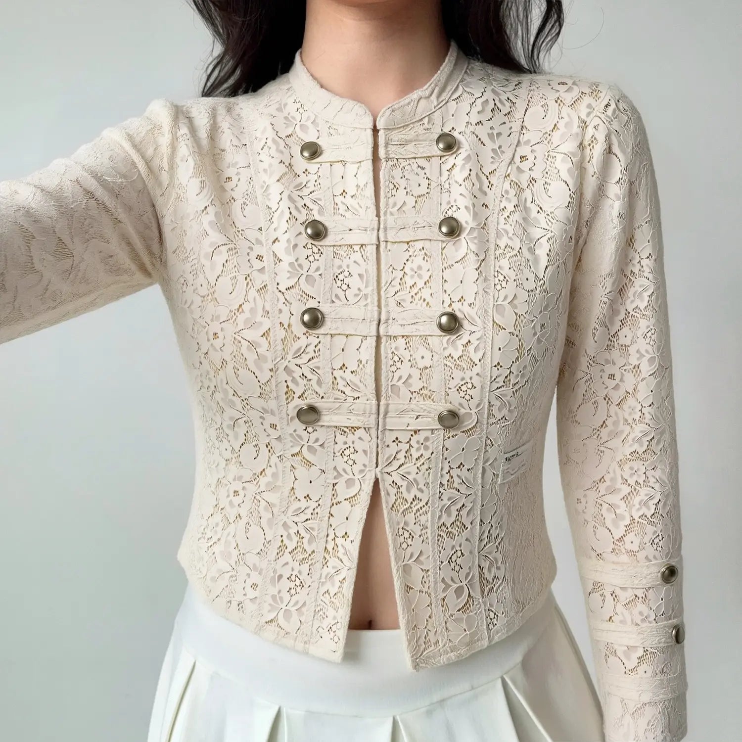 Women wearing cream lace cropped blazer, vintage military style fitted lace outerwear with white skirt