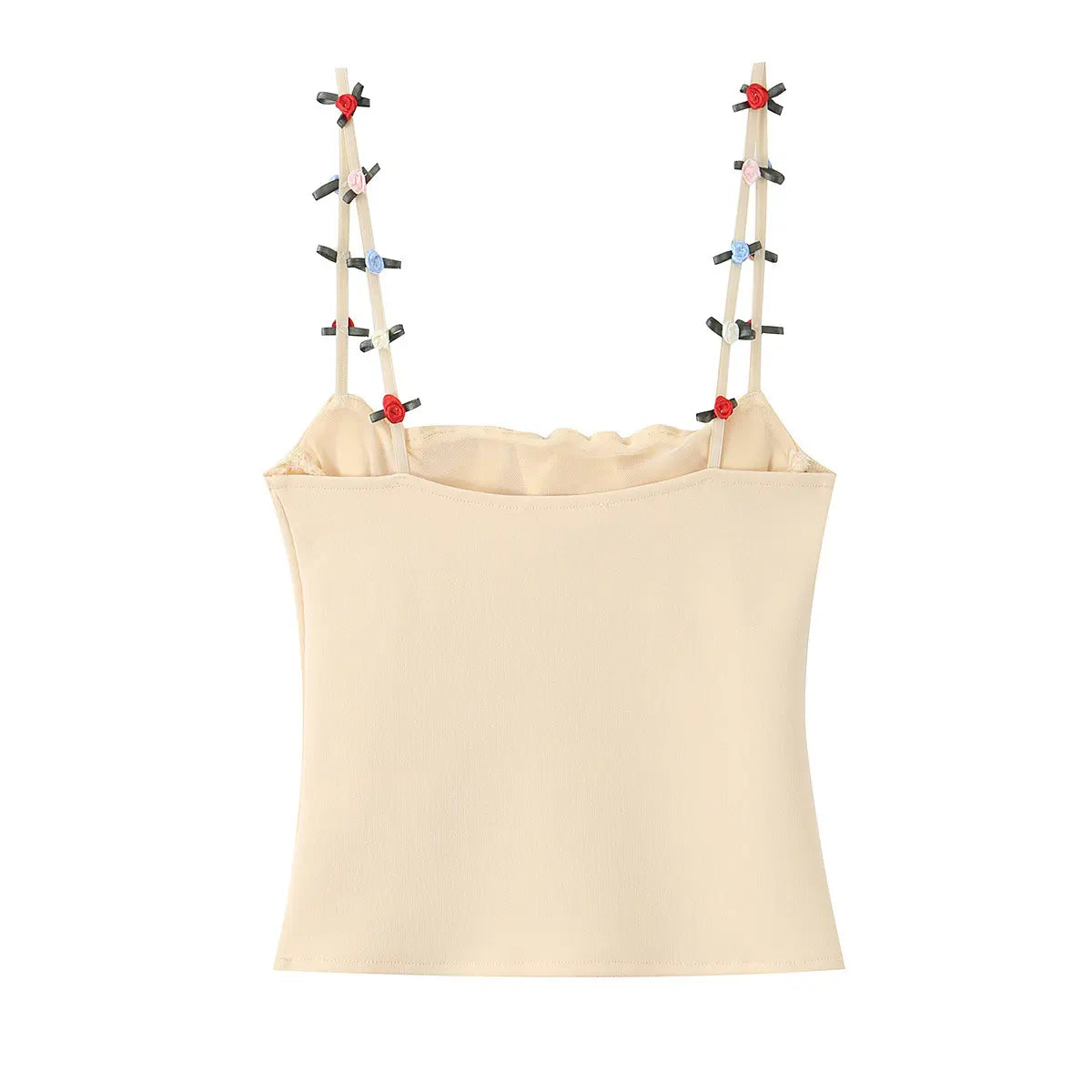 Back view of the cream cami top, showing the floral-embellished straps and smooth knit back panel