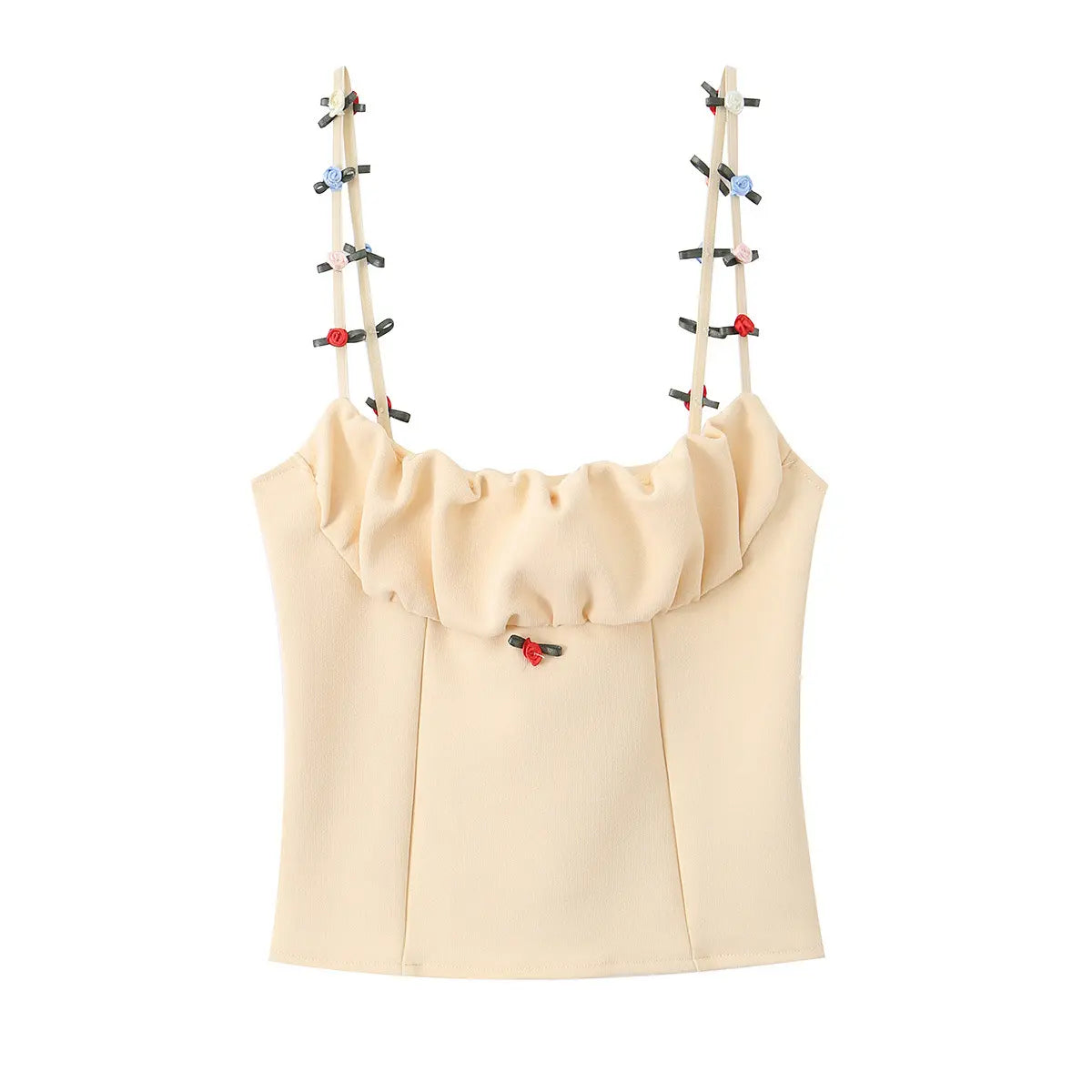 Flat-lay view of the cream cami top, featuring multicolored floral rosettes on straps, ruffled neckline, and structured corset-style bodice