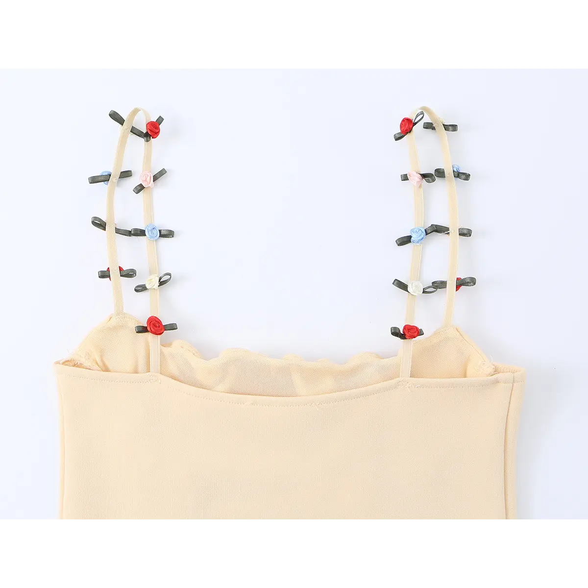  Close-up of the cami's straps, adorned with tiny multicolored floral rosettes and ribbon bows