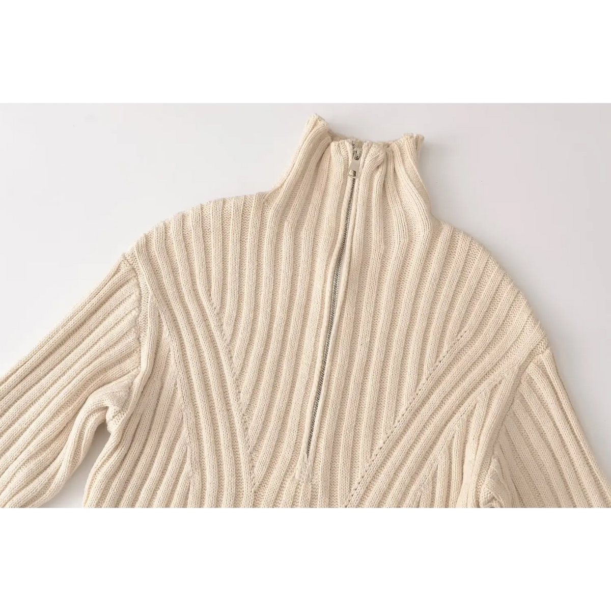Close-up of mock neck and half zip placket