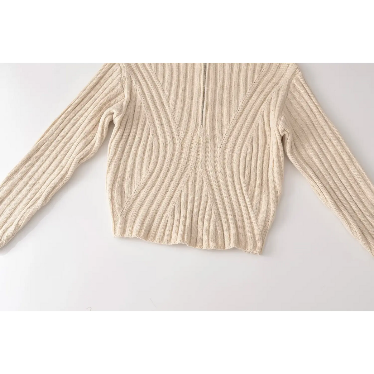 Close-up of cropped hem and diagonal rib panels