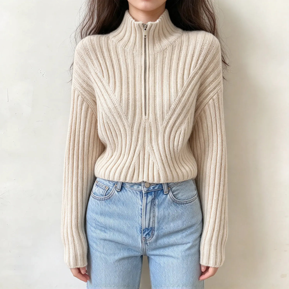 Model wearing cream half zip mock neck ribbed knit sweater, front view