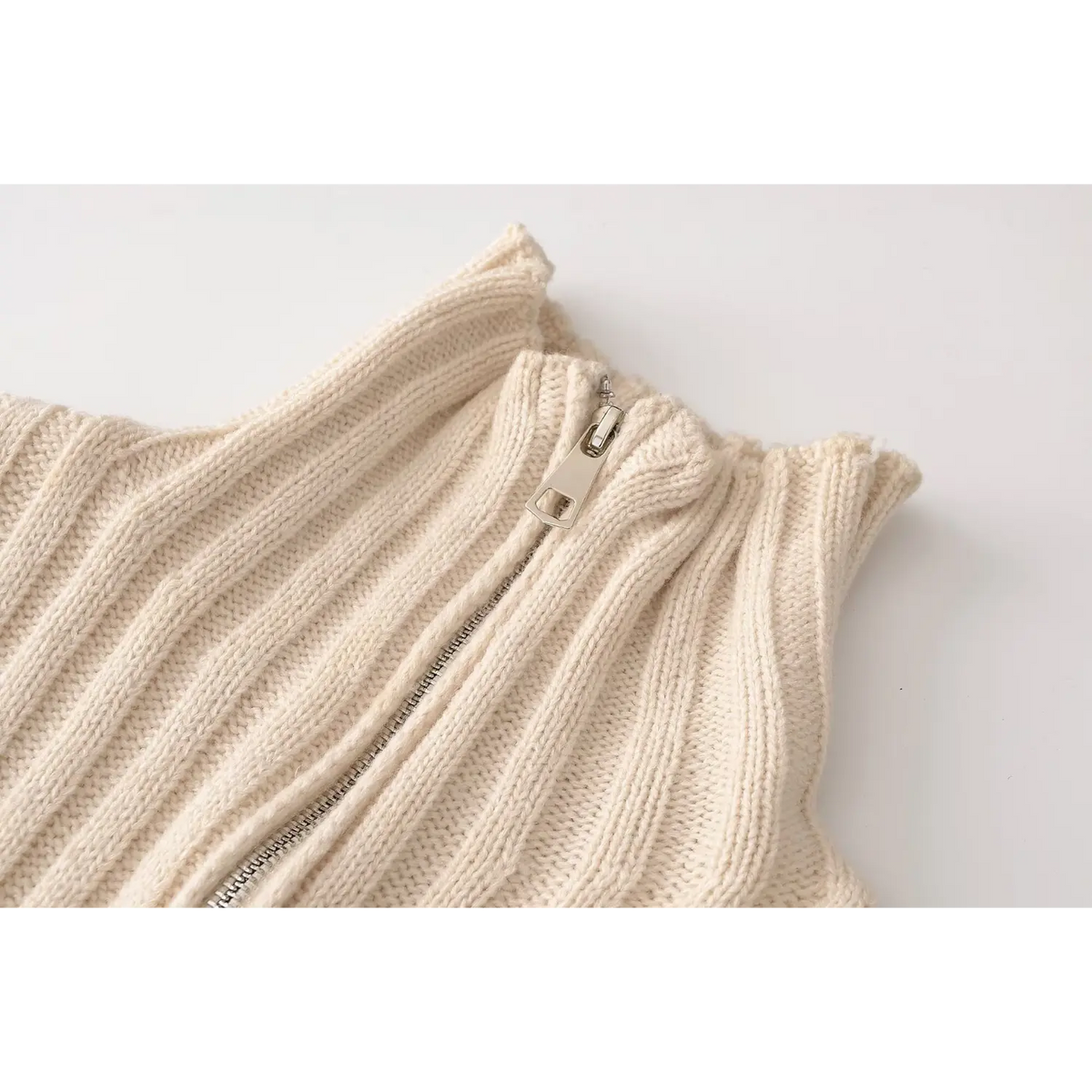 Close-up of metal half zip pull tab