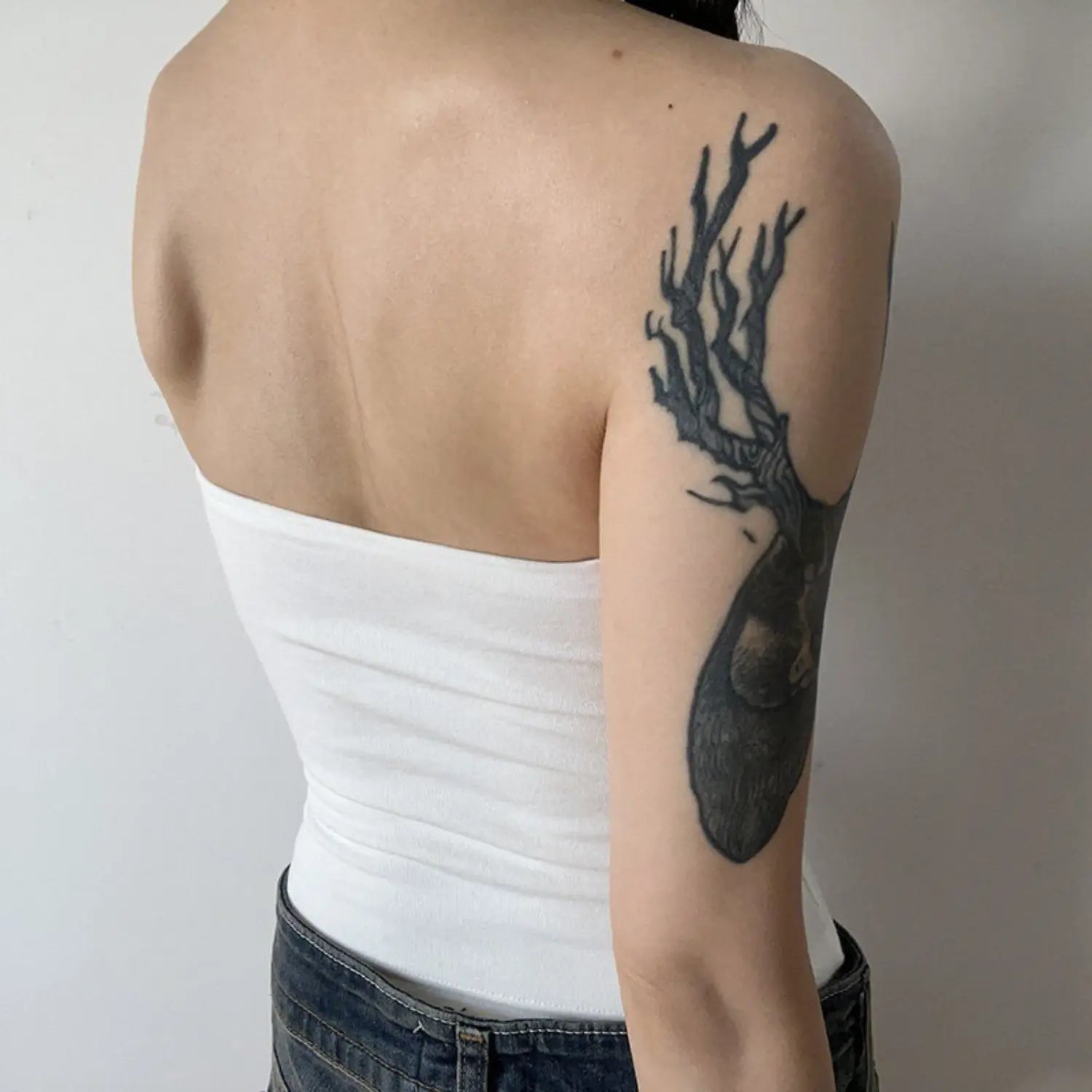 Cream halter knit cami full back model shot, one-piece seamless smooth back thin halter tie plain minimalist back fit display