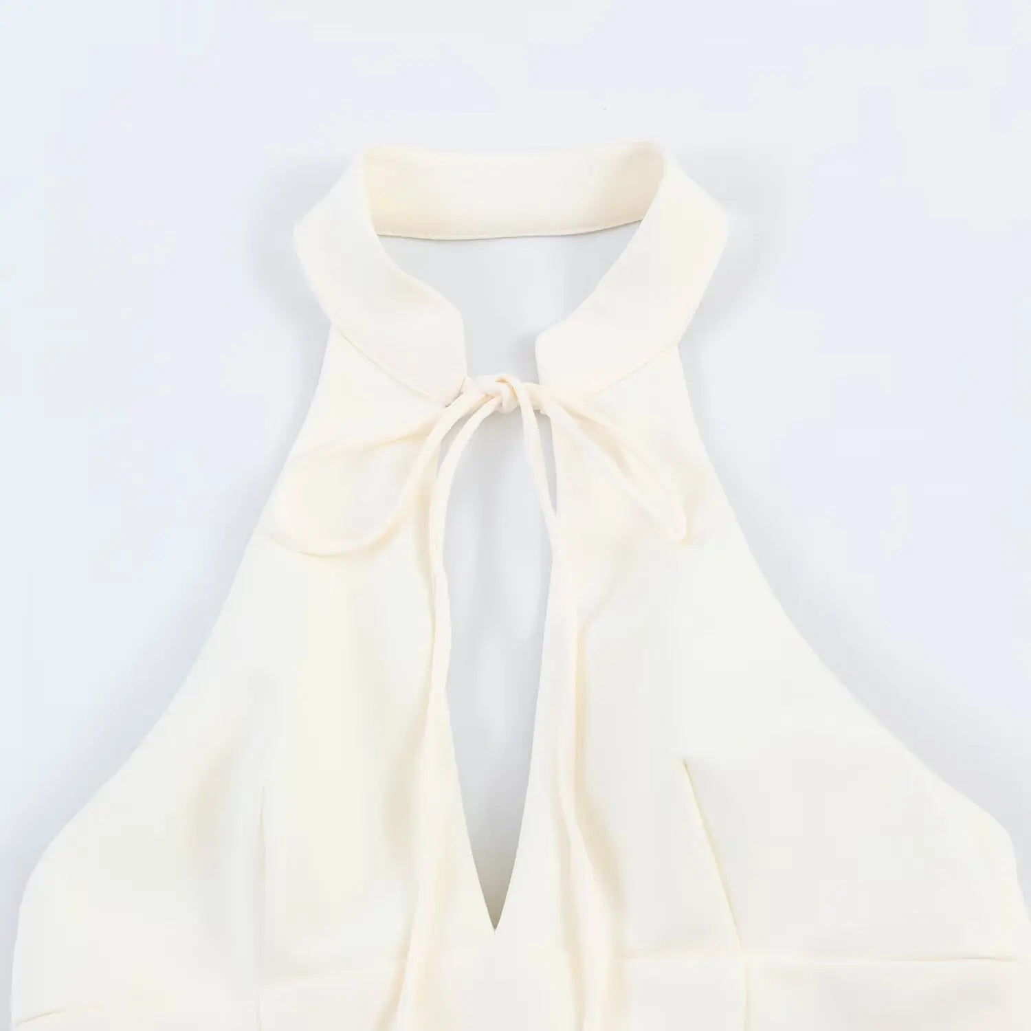 Close-up detail of stand halter collar and self-fabric front tie keyhole