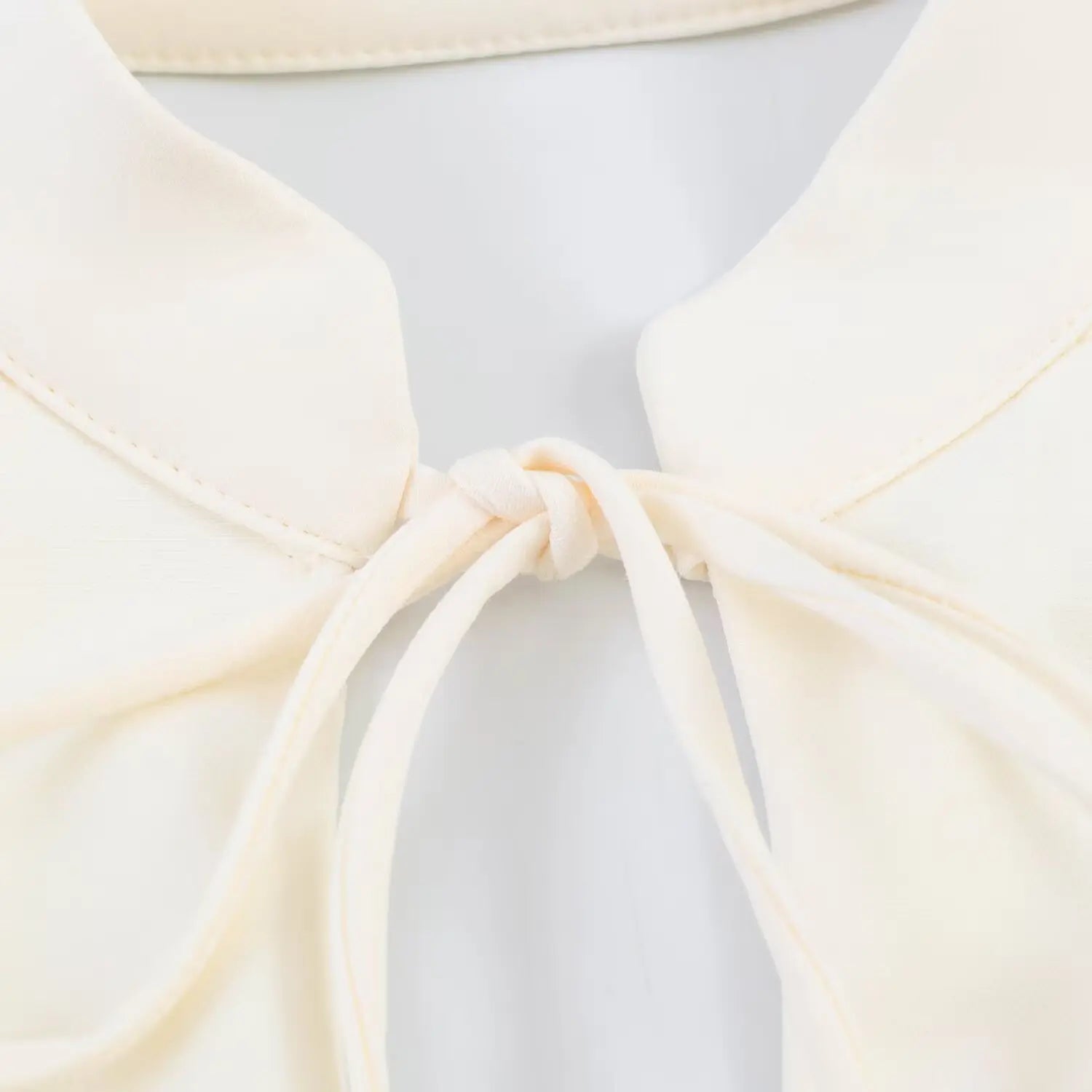 Close-up of front fabric tie knot workmanship