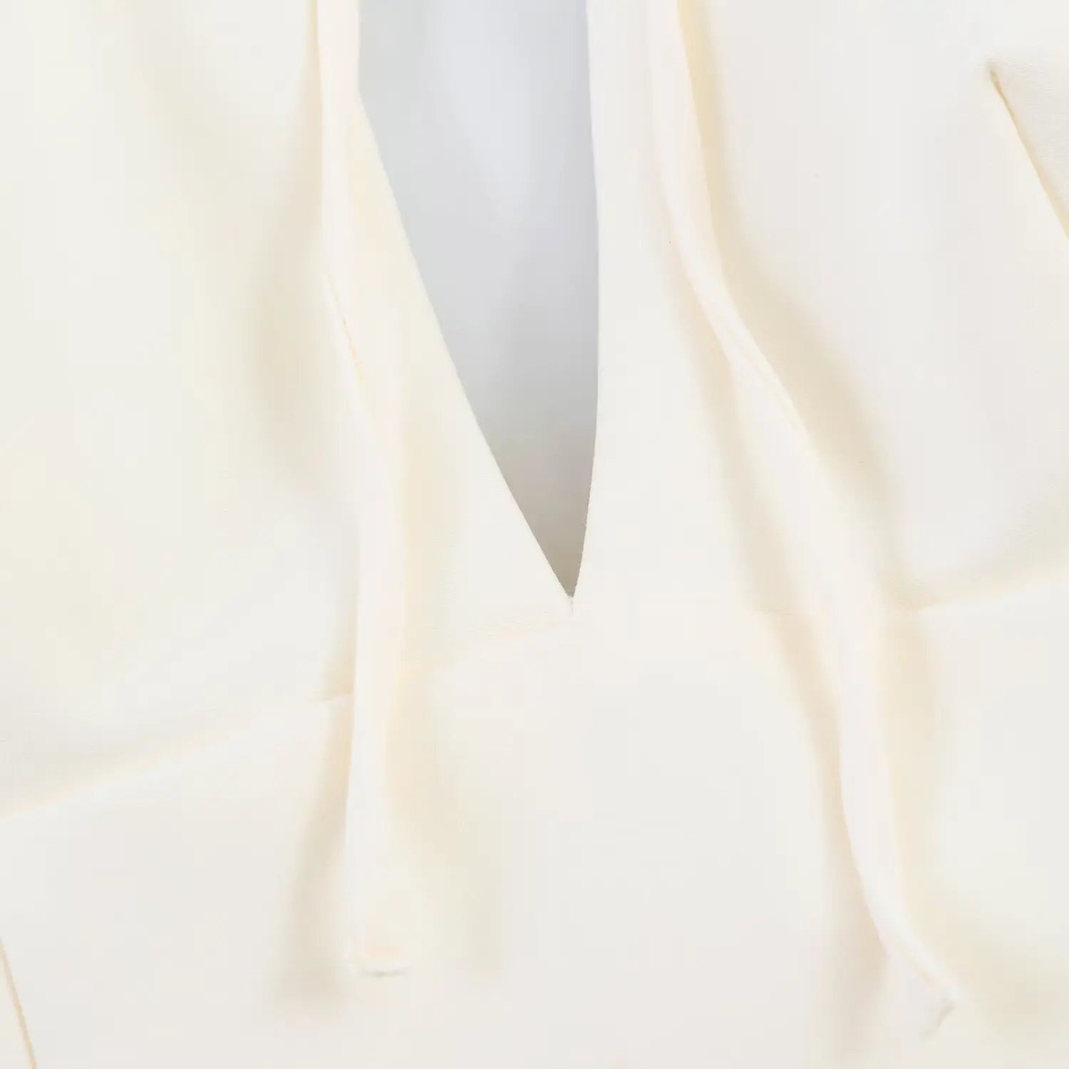 Detail view of front V keyhole cutout below tie