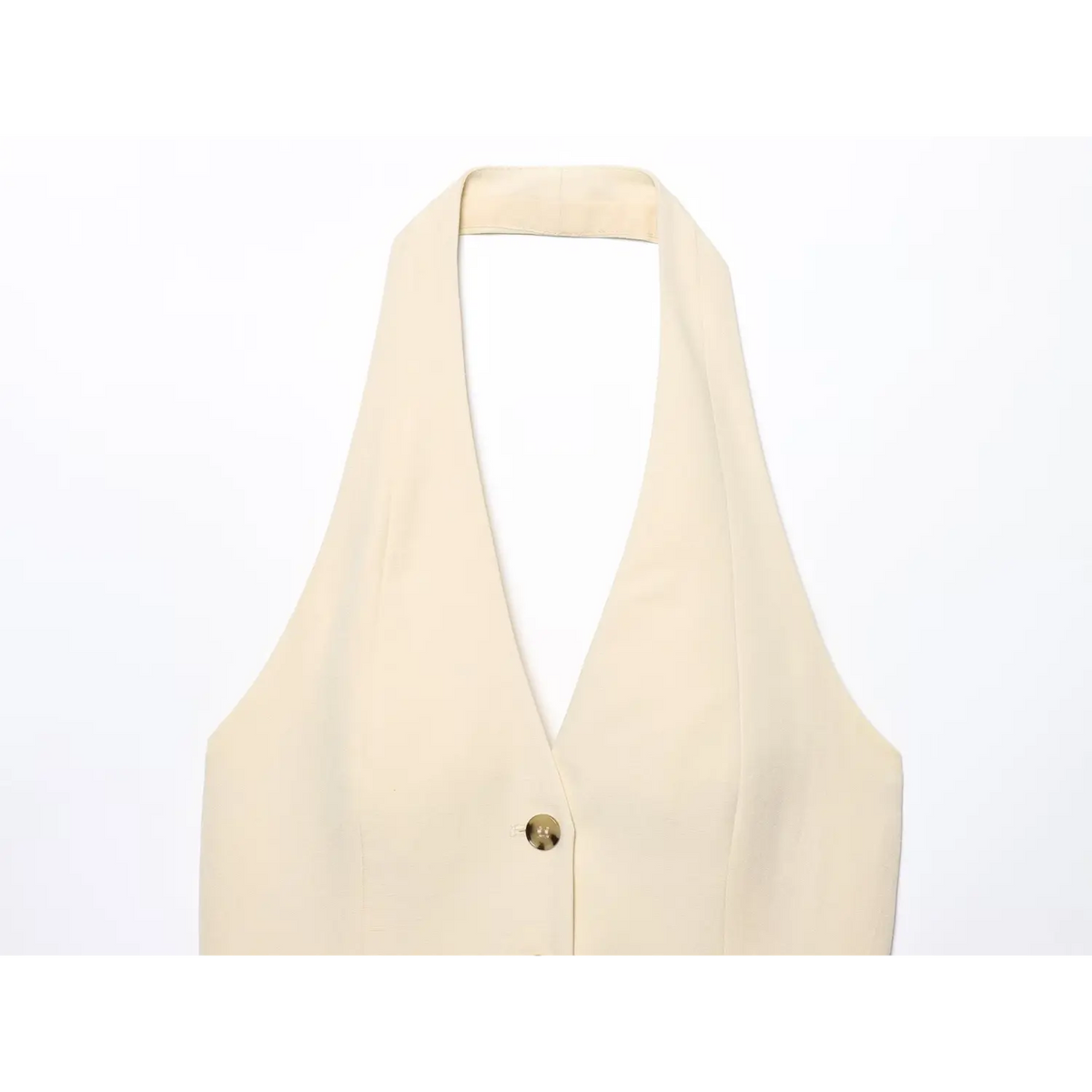 Close-up of halter neck strap and deep V neckline