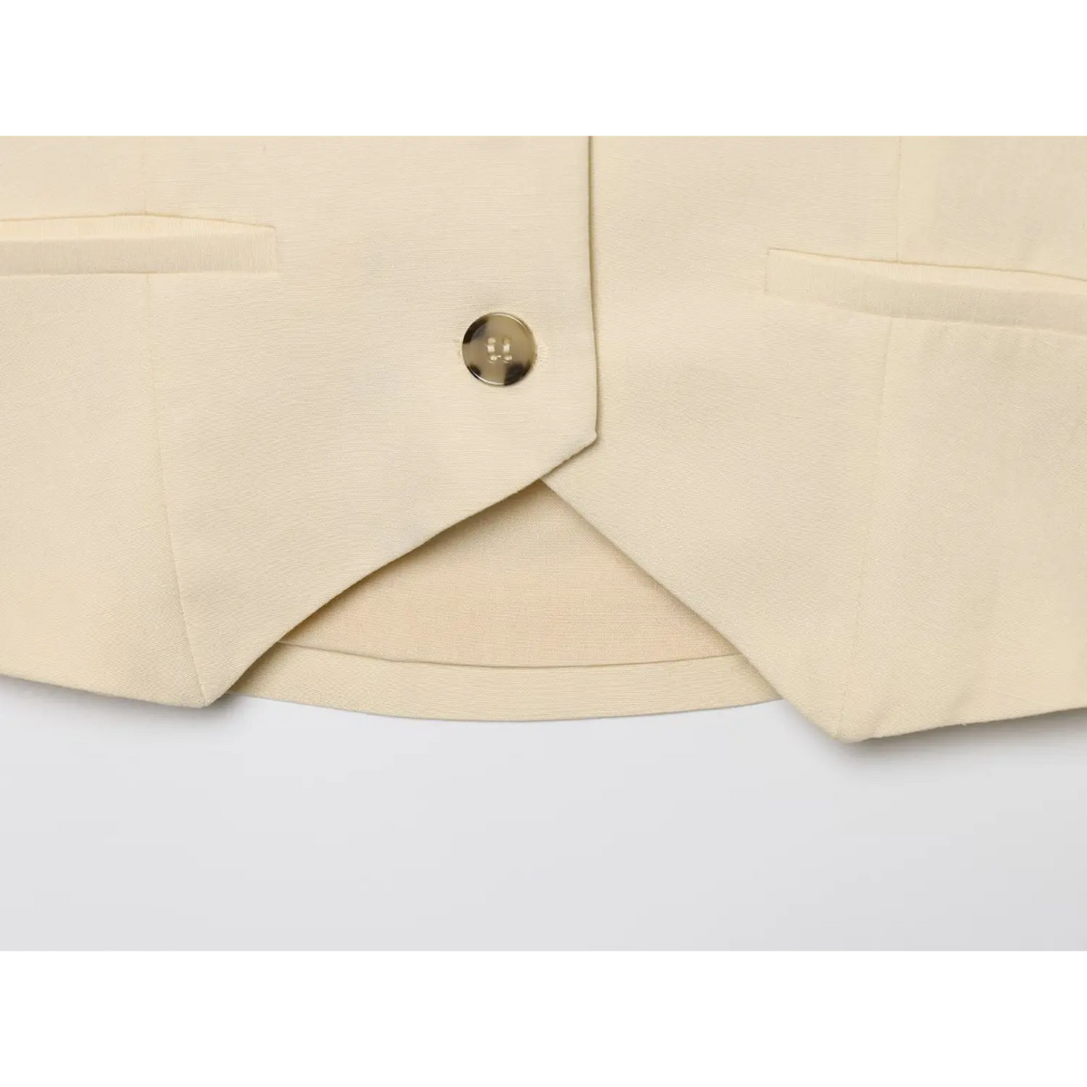 Close-up of pointed front hem