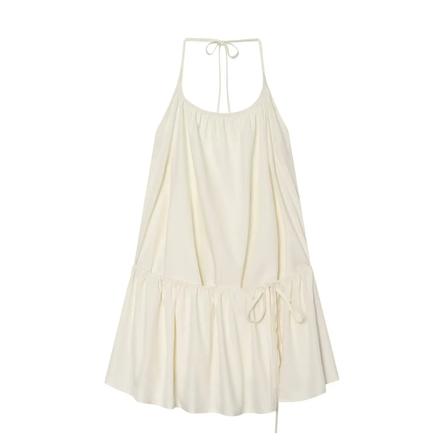 Flat lay front view of cream halter tiered mini dress, halter tie‑back neck, elastic gathered bust, side drawstring waist, flowy ruffle hem, isolated white background