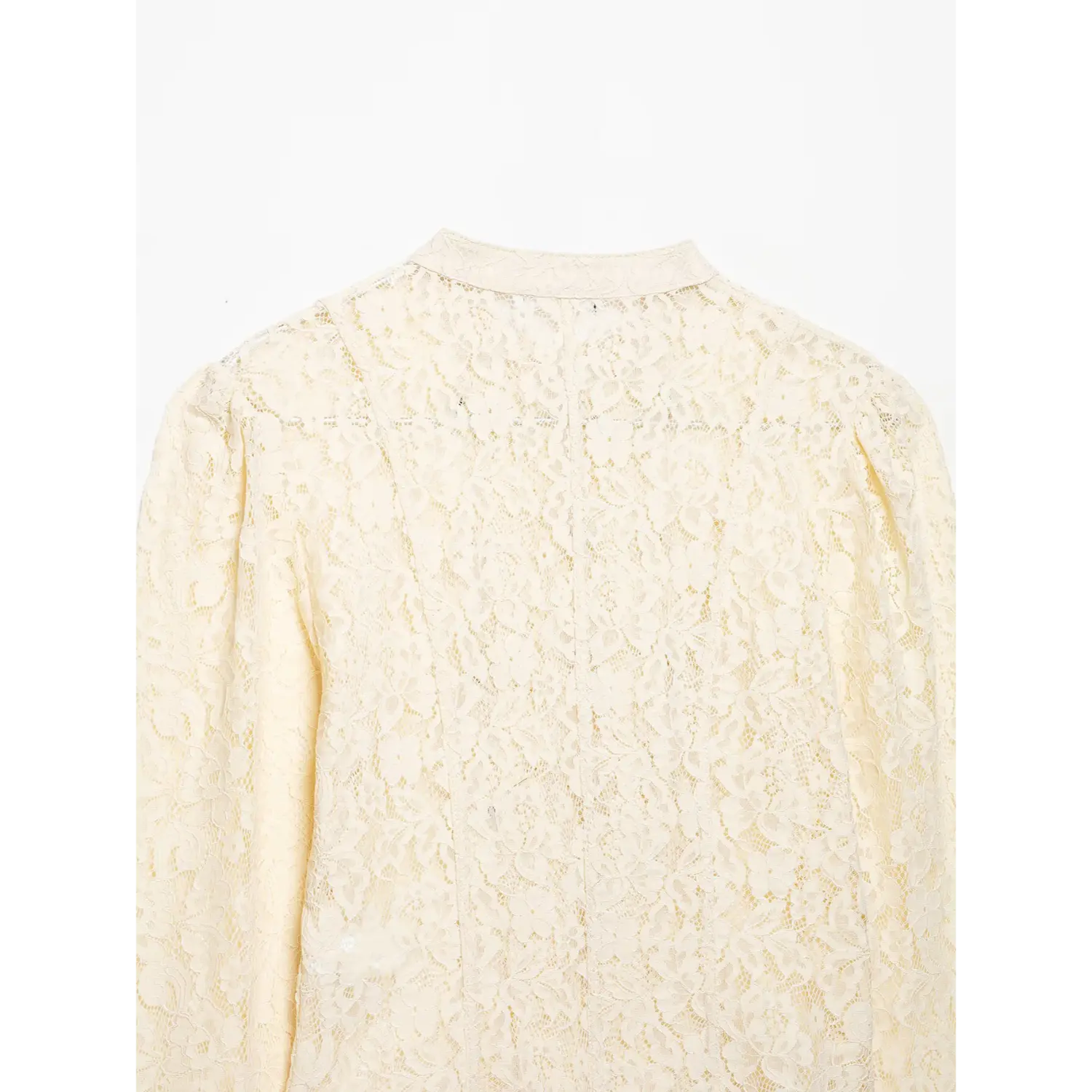 Back view of cream lace cropped jacket, stand collar, puff shoulder, full floral lace construction on white background