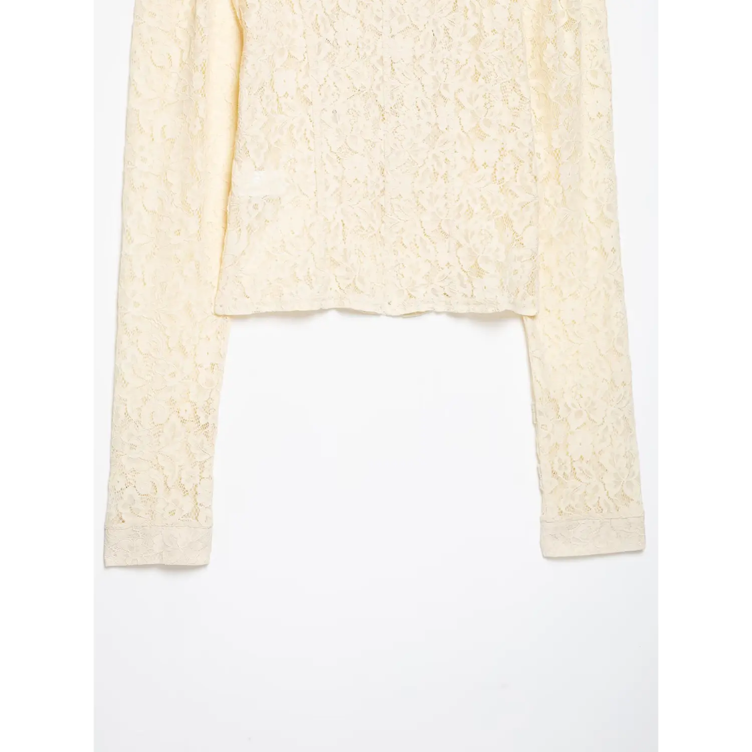 Partial back view cream lace cropped jacket, cropped hem and full long lace sleeves laid flat on white background