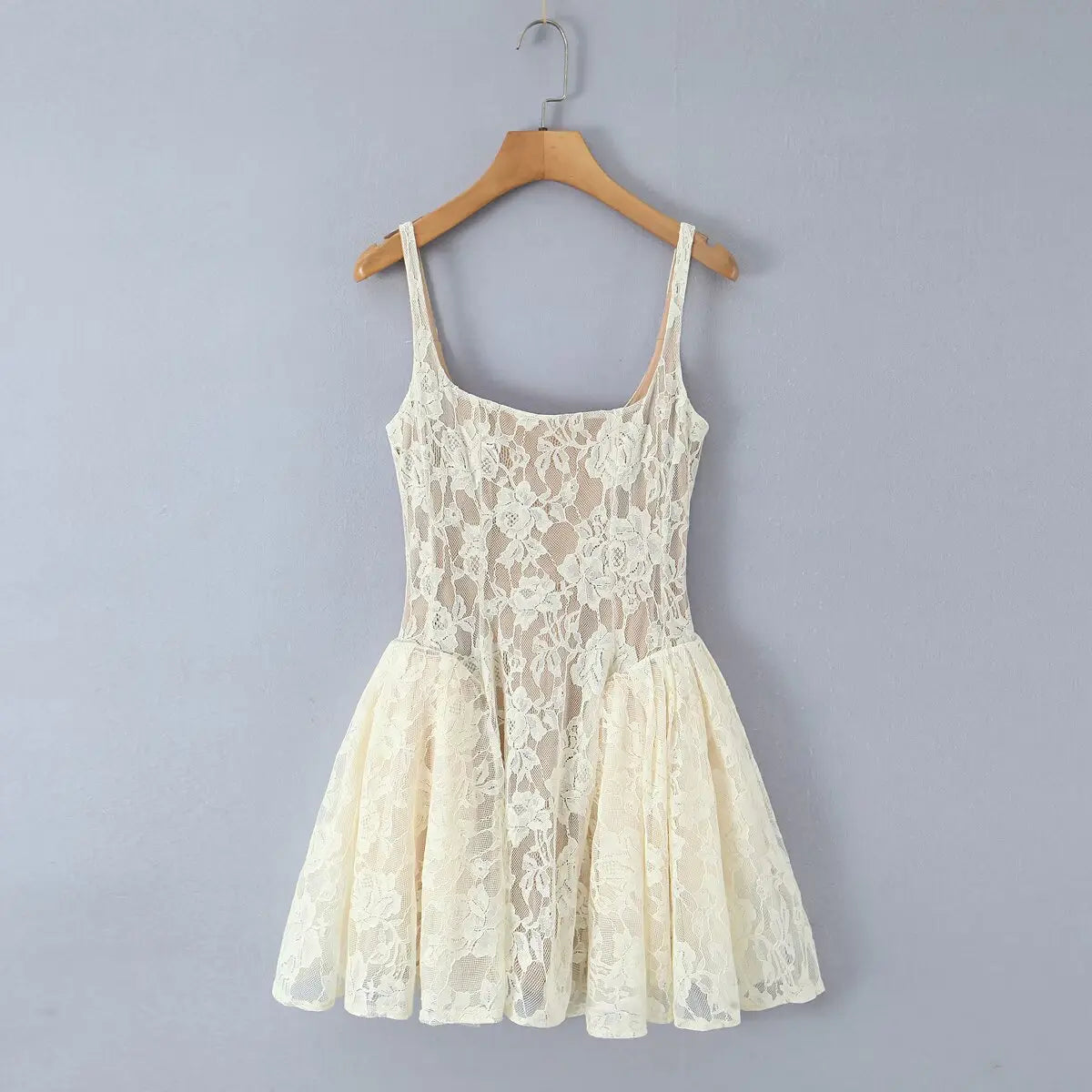 Full front view of the dress, featuring the square neckline, all-over floral lace, and classic skater silhouette.