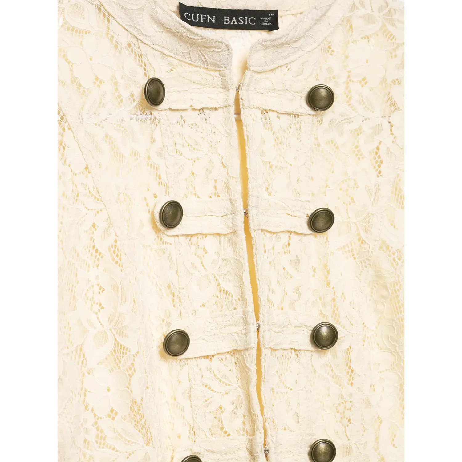 Macro close‑up, double‑breasted antique metal buttons and floral lace texture on cream cropped lace jacket