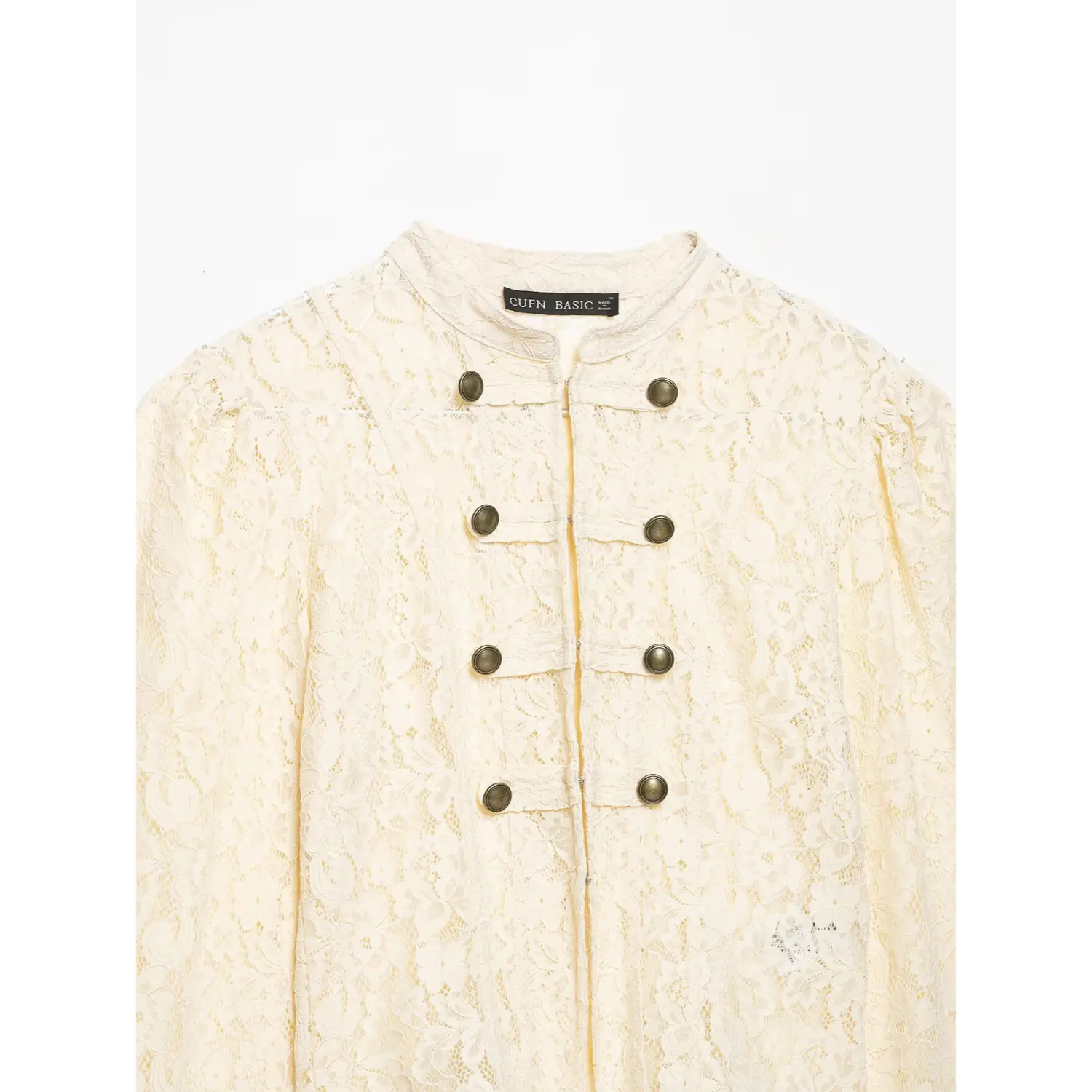 Close‑up front placket of cream lace cropped jacket, stand collar, double breasted antique metal buttons, floral lace