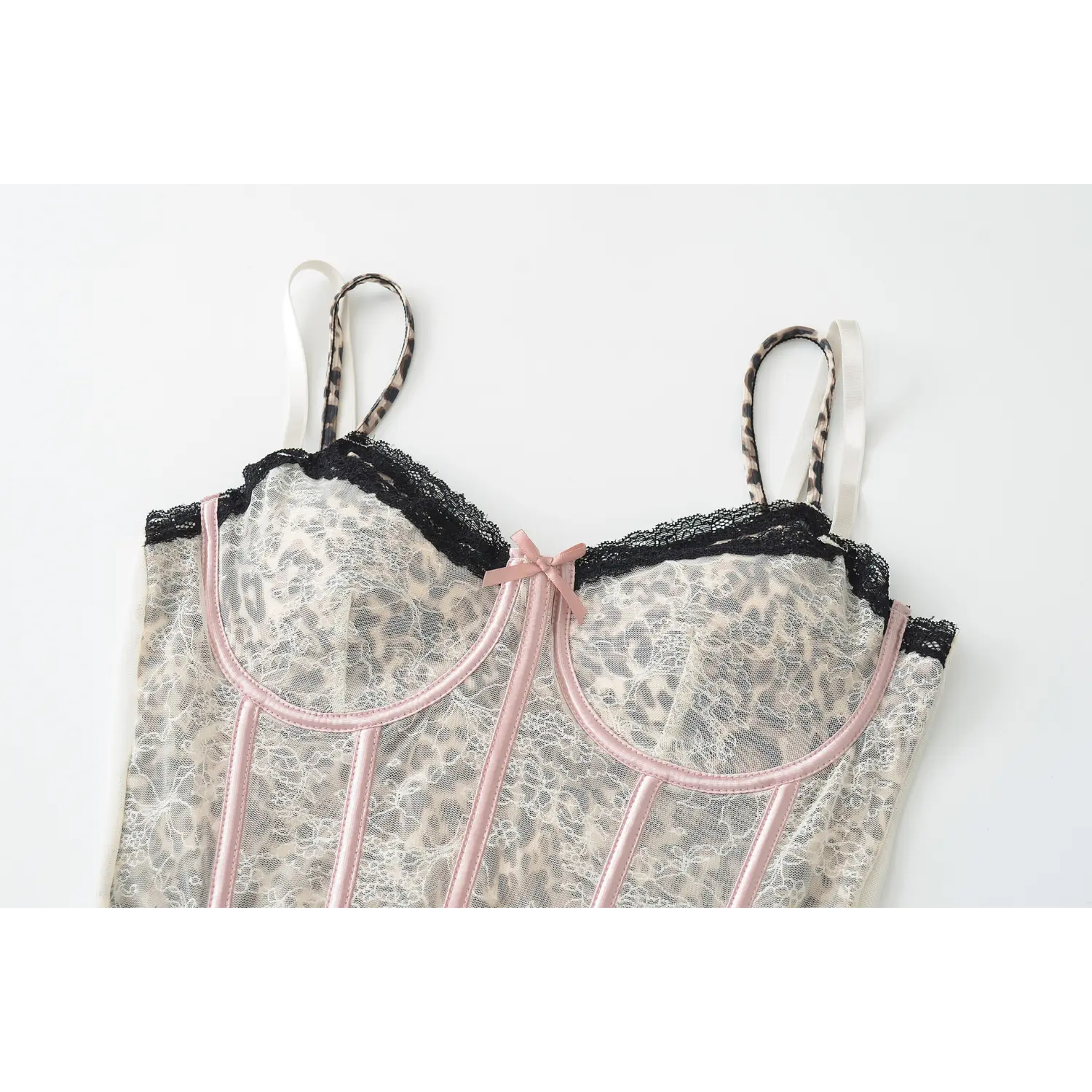 Cream leopard lace corset tank wooden hanger front full product shot, v-neck black lace bow bone waist cincher cropped fit double leopard adjustable straps mesh camisole white background photo
