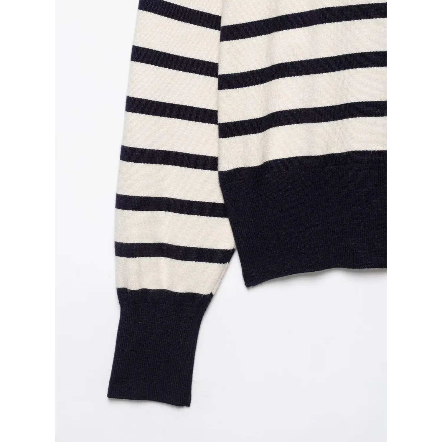 Sleeve and hem close‑up, ribbed navy cuffs and bottom hem, horizontal stripe knit