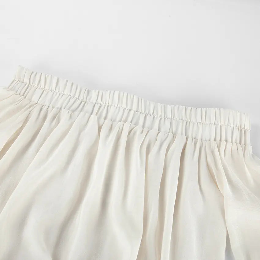 Close-up of elastic off shoulder smocked neckline