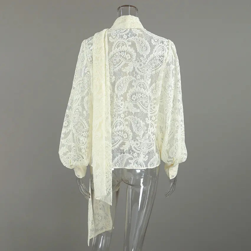 Cream paisley lace pussy bow button blouse on mannequin, back view