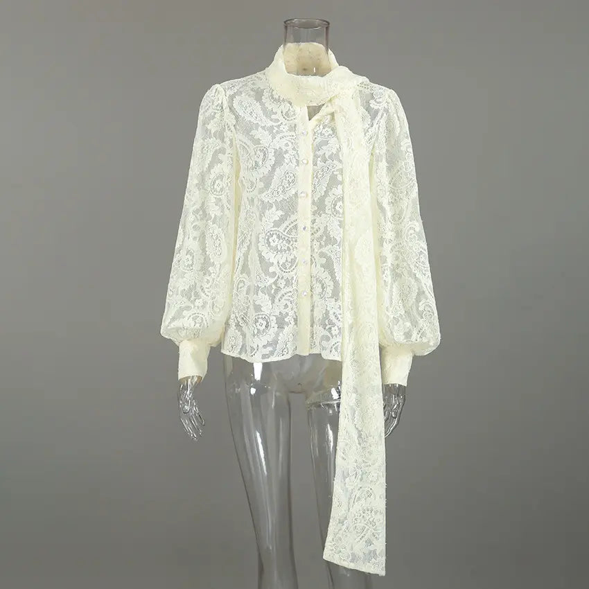 Cream paisley lace pussy bow button blouse on mannequin, front view