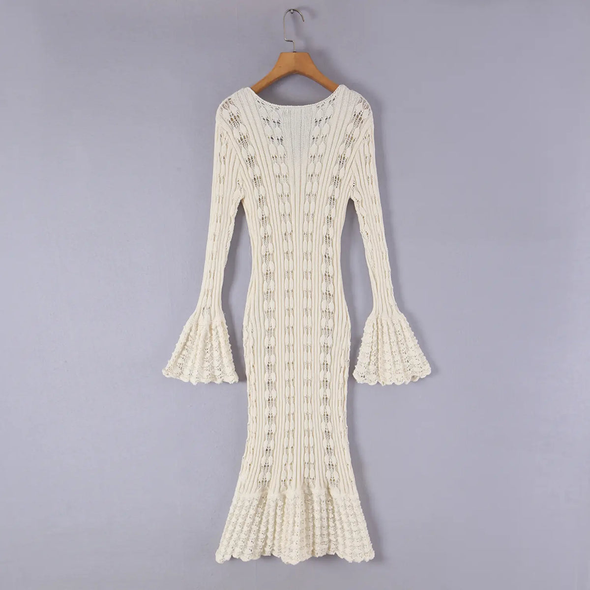 Hanging back view of cream pointelle knit bell sleeve mermaid midi dress