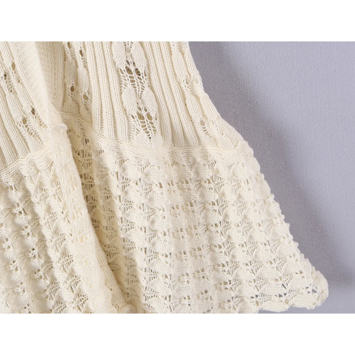 Close-up of mermaid hem knit detail