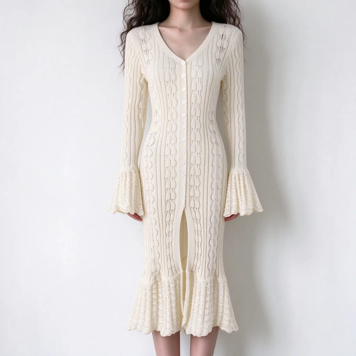 Model wearing cream pointelle knit bell sleeve mermaid midi dress, front view