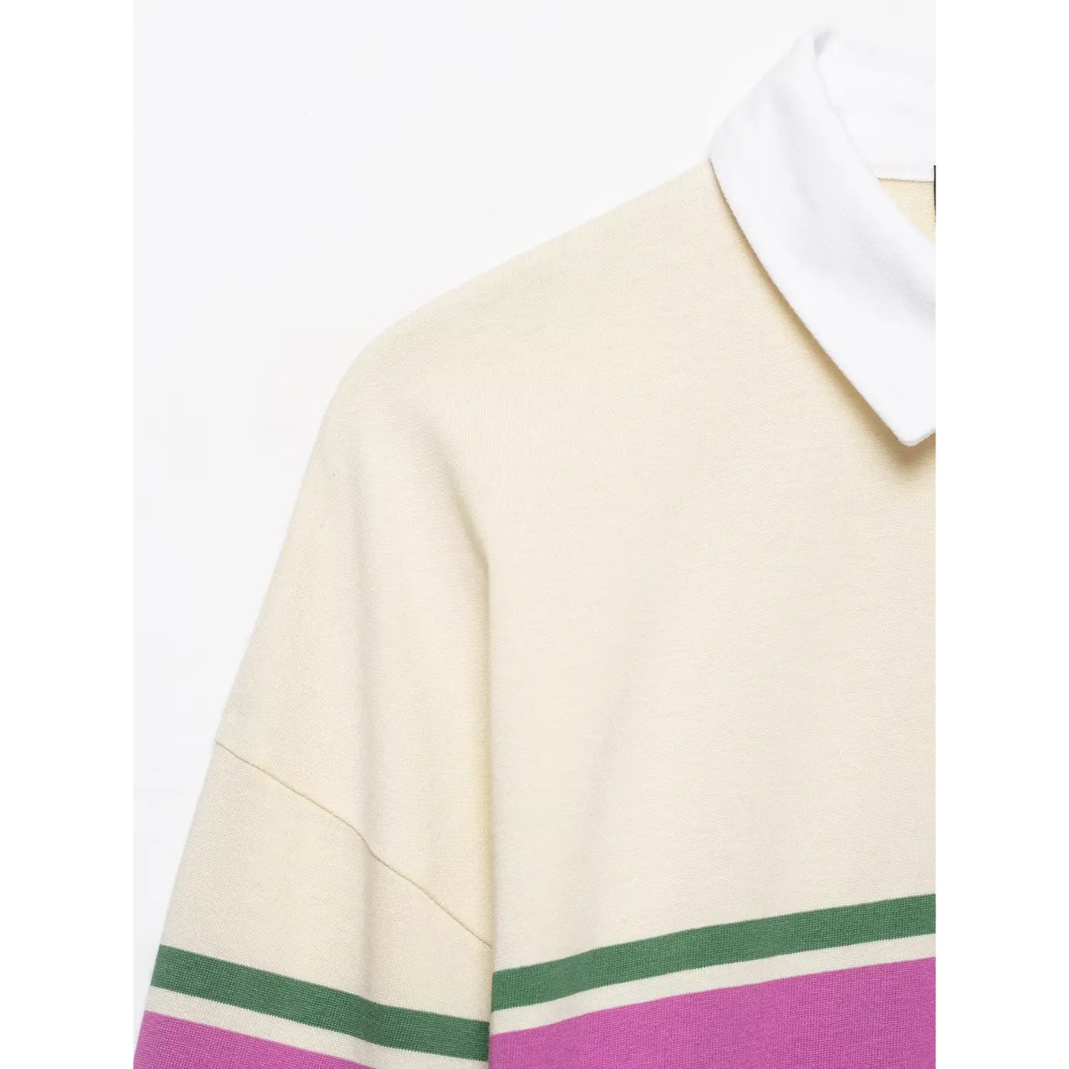 Close‑up drop shoulder seam and knit fabric texture detail cream color‑block striped long sleeve polo top