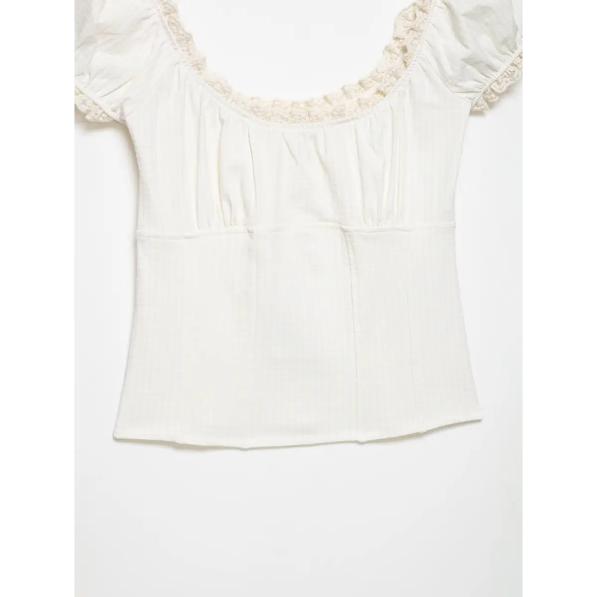 Close-up of the top's bodice, showing the vertical seams and gathered front detailing.